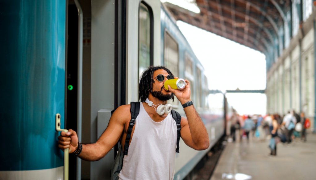 A surfer traveling by train during a surf trip in Sri Lanka